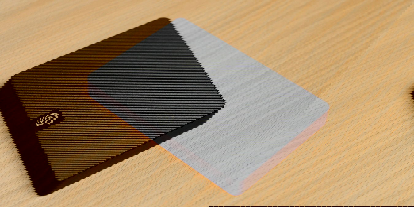 Black external hard drive on a brown desk