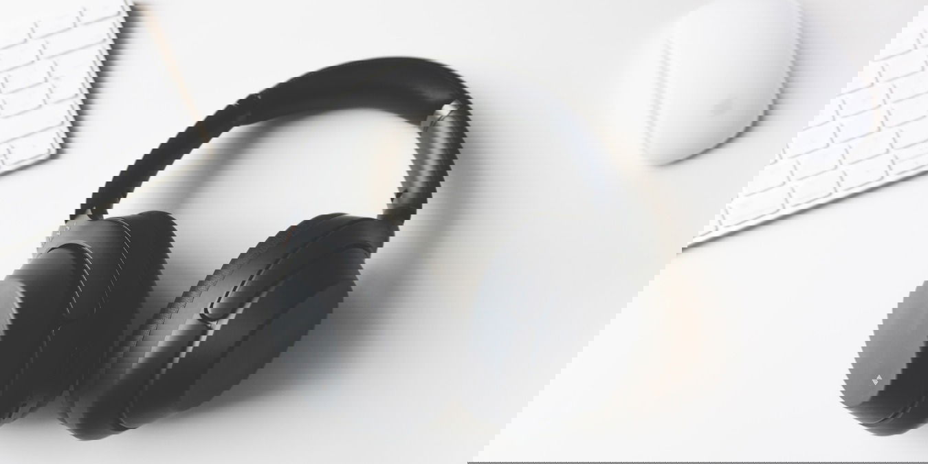 Sony headphones next to a keyboard and mouse